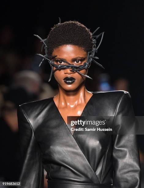 Model walks the runway at the Gareth Pugh show during London Fashion Week February 2018 at Ambika P3 on February 17, 2018 in London, England.