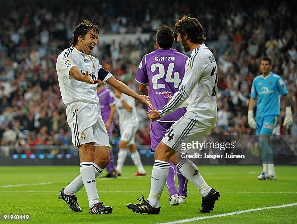 Raul Gonzalez of Real Madrid celebrates scoring his sides opening goal with his teammate Esteban Granero during the La Liga match between Real Madrid...