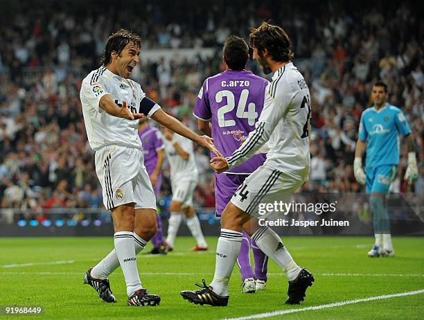 Raul Gonzalez of Real Madrid celebrates scoring his sides opening goal with his teammate Esteban Granero during the La Liga match between Real Madrid...