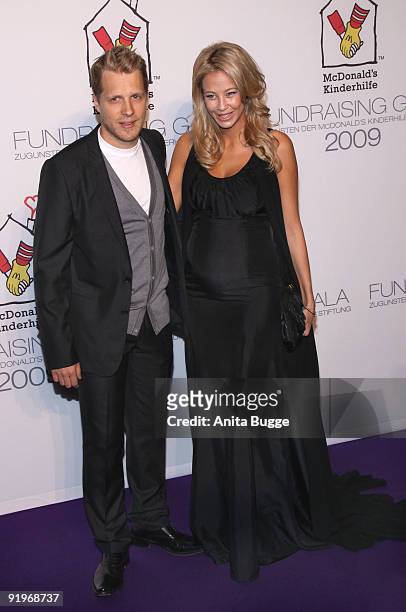 Oliver Pocher and Sandy Meyer-Woelden attend the Mc Donalds Fundraising Gala at Hyatt Hotel on October 17, 2009 in Berlin, Germany.