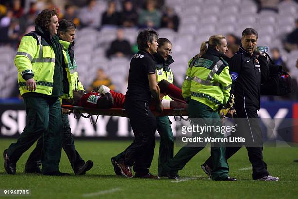 Yannick Nyanga of Toulouse is carried off the pitch injured during the Heineken Cup match between Harlequins and Toulouse at The Stoop on October 17,...