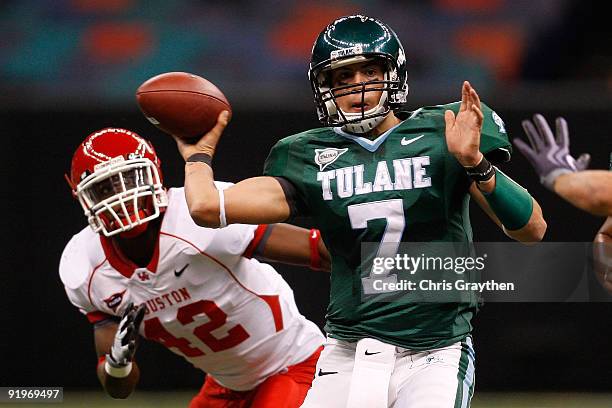 Quarterback Joe Kemp of the Tulane Green Wave throws the ball under pressure from Phillip Steward of the Houston Cougars at the Louisiana Superdome...