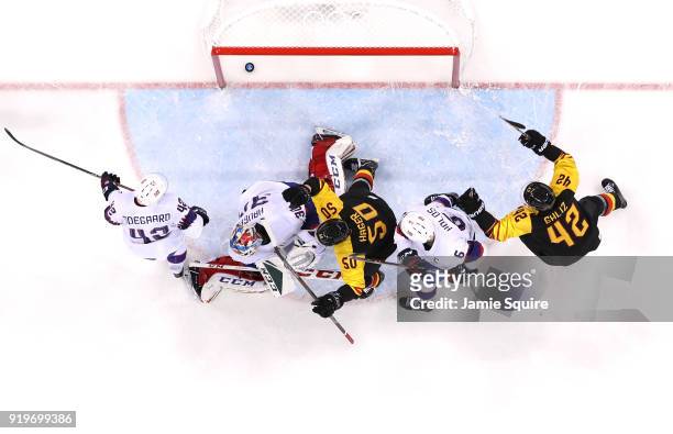 Patrick Hager of Germany celebrates after scoring a goal in the second period against Lars Haugen of Norway during the Men's Ice Hockey Preliminary...