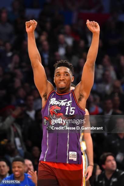 Donovan Mitchell of the Utah Jazz celebrates after recreating Vince Carter's classic dunk during the Verizon Slam Dunk Contest during State Farm...