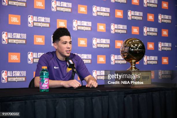 Devin Booker of the Phoenix Suns speaks at a press conference following his victory in the JBL Three-Point Contest during State Farm All-Star...