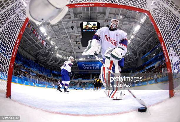 Lars Haugen of Norway reacts after allowing a goal against Patrick Hager of Germany in the second period during the Men's Ice Hockey Preliminary...