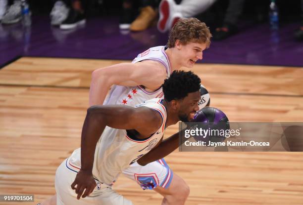 Joel Embiid of the Philadelphia 76ers and Lauri Markkanen of the Chicago Bulls compete in the 2018 Taco Bell Skills Challenge at Staples Center on...