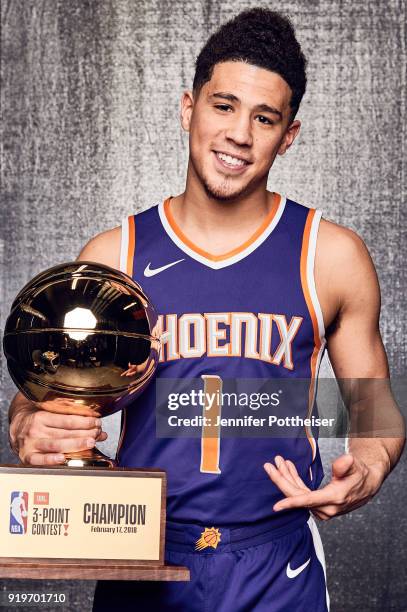 Devin Booker of the Phoenix Suns poses for a portrait after winning the the JBL Three Point Contest during All-Star Saturday Night as part of 2018...