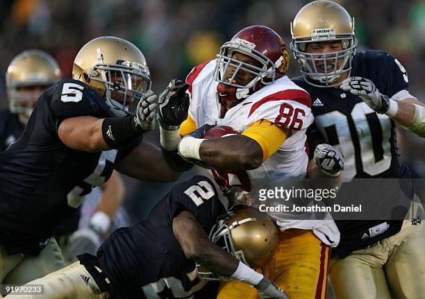 Tight end Anthony McCoy of the USC Trojans breaks through the Notre Dame Fighting Irish during the third quarter of the game at Notre Dame Stadium on...