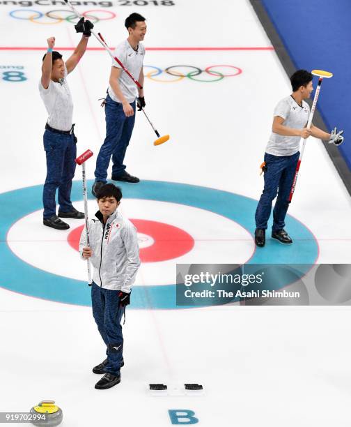 Yusuke Morozumi, Tsuyoshi Yamaguchi, Tetsuro Shimizu and Kosuke Morozumi of Japan celebrate winning the Curling round robin session 7 against the...