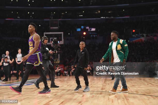 Donovan Mitchell of the Utah Jazz, Hendrix Hart and Kevin Hart compete in the 2018 Verizon Slam Dunk Contest at Staples Center on February 17, 2018...