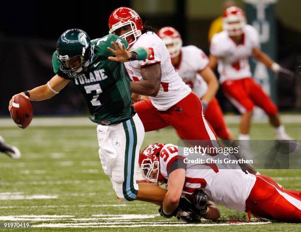 Quarterback Joe Kemp of the Tulane Green Wave is sacked by Zeke Riser of the Houston Cougars at the Louisiana Superdome on October 17, 2009 in New...