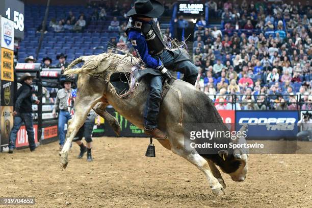 Eduardo Aparecido rides the bull Johnny Ringo during round one of the Professional Bull Riders St. Louis Invitational on February 17 at Scottrade...