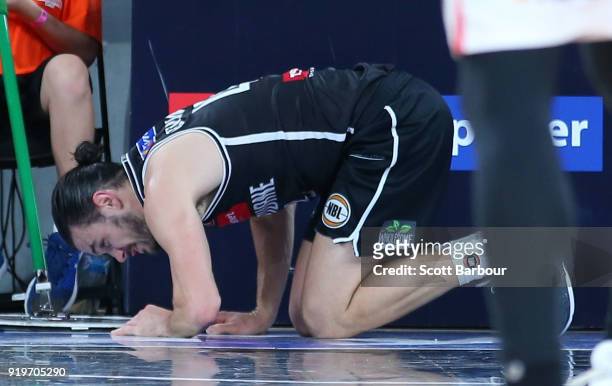 Chris Goulding of Melbourne United leaves the court injured during the round 19 NBL match between Melbourne United and the Illawarra Hawks at Hisense...