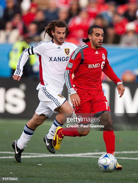 Midfielder Dwayne De Rosario of the Toronto FC fights for the ball with midfielder Kyle Beckerman of Real Salt Lake during the match at BMO Field on...