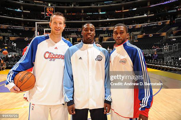 Wes Matthews of the Utah Jazz stands between Steve Novak and Jerel McNeal of the Los Angeles Clippers before their game at Staples Center on October...