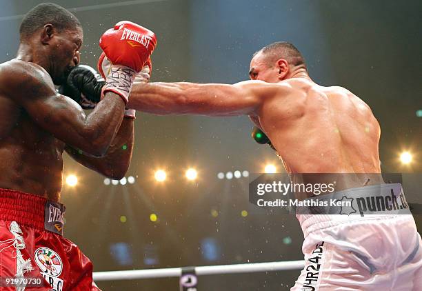 Arthur Abraham of Germany punches Jermain Taylor of the U.S. During the WBC Super Middleweight fight during the 'Super Six World Boxing Classic'...