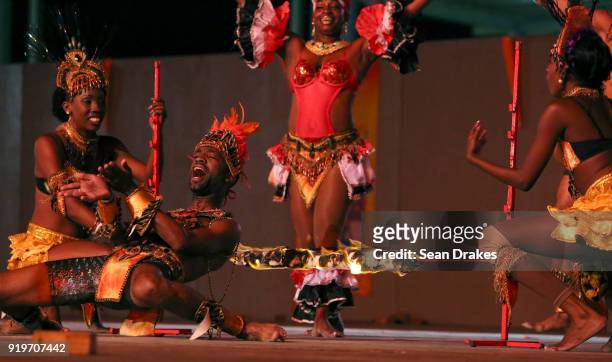Dancers perform a fiery limbo during the Champs of Steel Plus show as part of Trinidad Carnival in the Queen's Park Savannah on February 17, 2018 in...