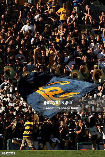 California Golden Bears cheerleader waves a flag in front of the Cal band and visitor's section in the game with the UCLA Bruins on October 17, 2009...