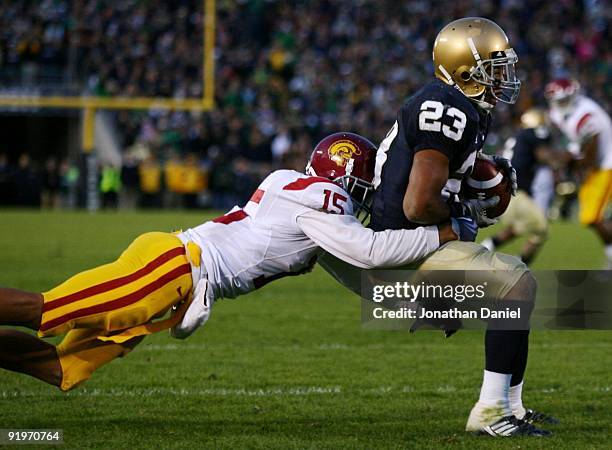 Wide receiver Golden Tate of the Notre Dame Fighting Irish makes a catch for a touchdown against Kevin Thomas of the USC Trojans at Notre Dame...