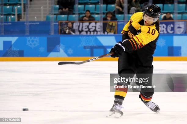Christian Ehrhoff of Germany shoots in the second period against Norway during the Men's Ice Hockey Preliminary Round Group B game on day nine of the...
