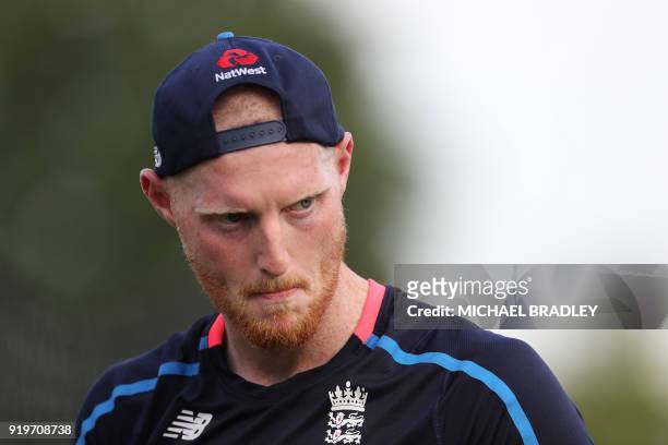 England's Ben Stokes, who is not playing, helps his teammates warm up prior to the Twenty20 Tri Series international cricket match between New...