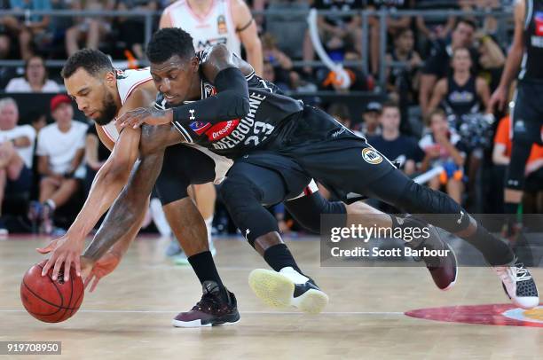 Casey Prather of Melbourne United and Demitrius Conger of the Hawks compete for the ball during the round 19 NBL match between Melbourne United and...