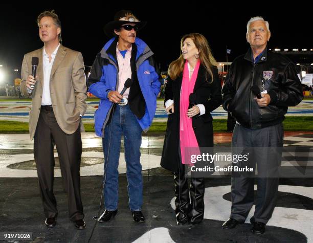 President Brian France, NASCAR Hall of Fame driver Richard Petty, Teresa Earnhardt, and NASCAR Hall of Fame driver Junior Johnson prepare to give the...