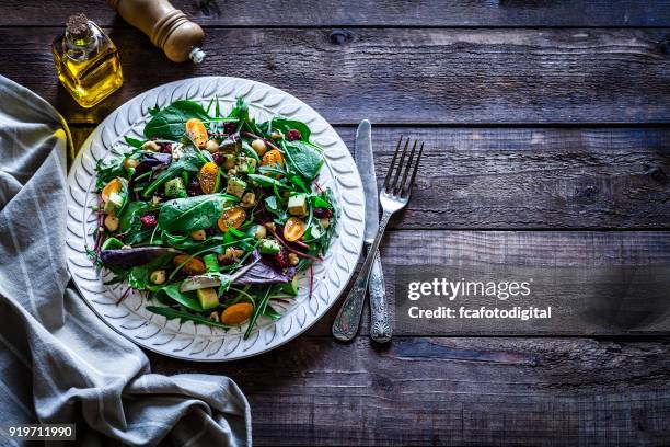 healthy fresh salad plate on rustic wooden table - chia seed oil stock pictures, royalty-free photos & images