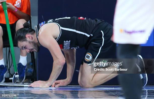 Chris Goulding of Melbourne United leaves the court injured during the round 19 NBL match between Melbourne United and the Illawarra Hawks at Hisense...