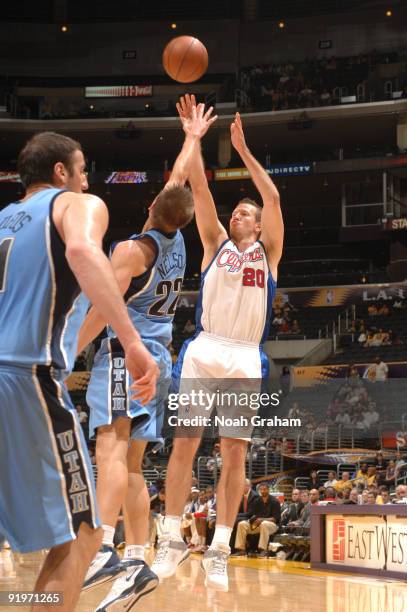 Steve Novak of the Los Angeles Clippers shoots against Spencer Nelson of the Utah Jazz at Staples Center on October 17, 2009 in Los Angeles,...