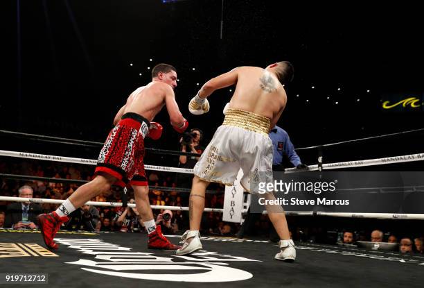 Danny Garcia connects on Brandon Rios and sends him to the canvas during the ninth round of their welterweight boxing match at the Mandalay Bay...