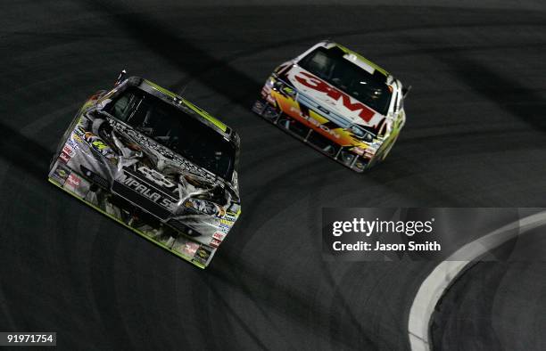 Jeff Gordon, driver of the Transformers 2 Chevrolet, races Greg Biffle, driver of the 3M Ford during the NASCAR Sprint Cup Series NASCAR Banking 500...