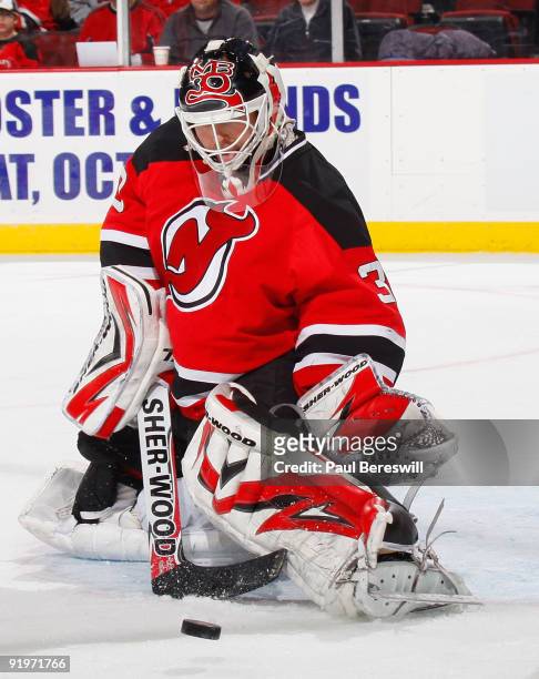 Goalie Martin Brodeur of the New Jersey Devils makes a save in the third period of his shutout victory over the Carolina Hurricanes at the Prudential...
