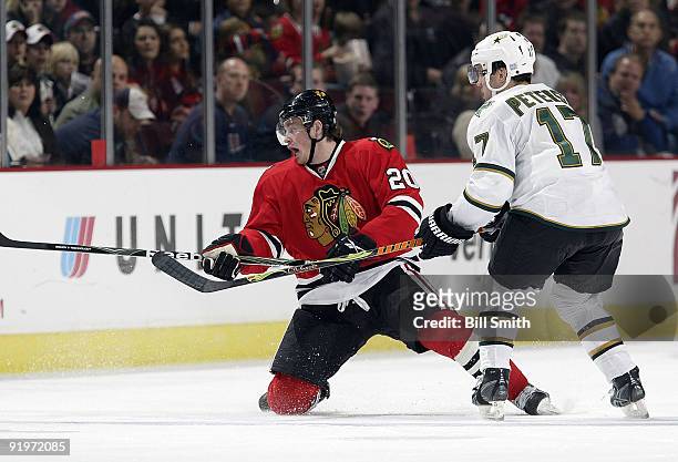 Jack Skille of the Chicago Blackhawks falls to one knee during a game against the Dallas Stars on October 17, 2009 at the United Center in Chicago,...