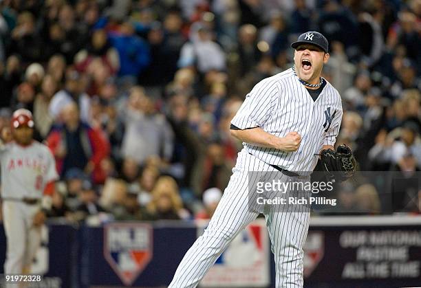 Joba Chamberlain of the New York Yankees pumps his fist after striking out Vladimir Guerrero for the third out in the top of the seventh inning...