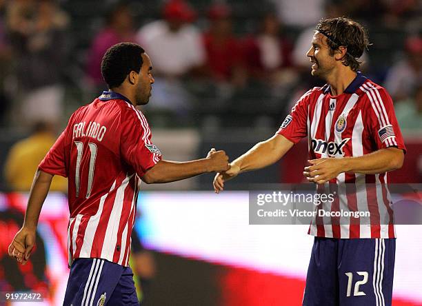 Maykel Galindo of Chivas USA celebrates his goal with teammate Carey Talley after Galindo scored his first half goal against the San Jose Earthquakes...