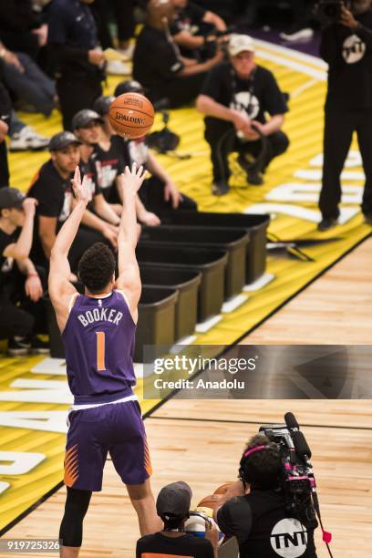 Devin Booker of the Phoenix Suns competes in the JBL Three-Point Contest during State Farm All-Star Saturday Night, as part of All-Star Weekend at...