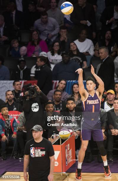 Devin Booker of the Phoenix Suns competes in the JBL Three-Point Contest during State Farm All-Star Saturday Night, as part of All-Star Weekend at...