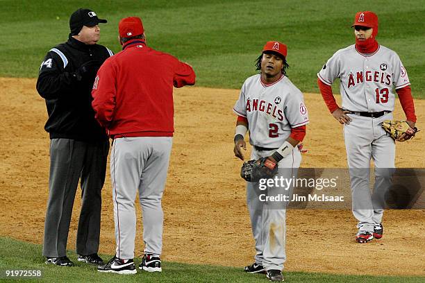 Mike Scioscia, Manager of the Los Angeles Angels of Anaheim, argues with second base umpire Jerry Layne who called Jorge Posada of the New York...