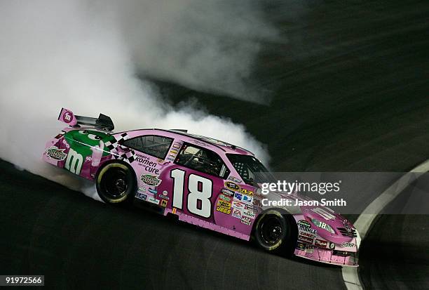 Kyle Busch, driver of the M&M's Toyota, loses control of his car during the NASCAR Sprint Cup Series NASCAR Banking 500 at Lowe's Motor Speedway on...