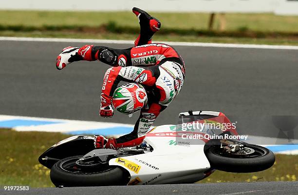Roberto Locatelli of Italy and the Metis Gilera Team crashes during the 250cc race at the Australian MotoGP, which is round 15 of the MotoGP World...