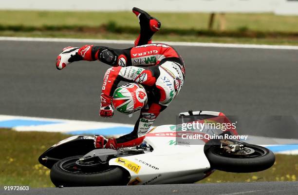 Roberto Locatelli of Italy and the Metis Gilera Team crashes during the 250cc race at the Australian MotoGP, which is round 15 of the MotoGP World...