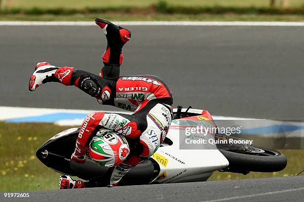 Roberto Locatelli of Italy and the Metis Gilera Team crashes during the 250cc race at the Australian MotoGP, which is round 15 of the MotoGP World...