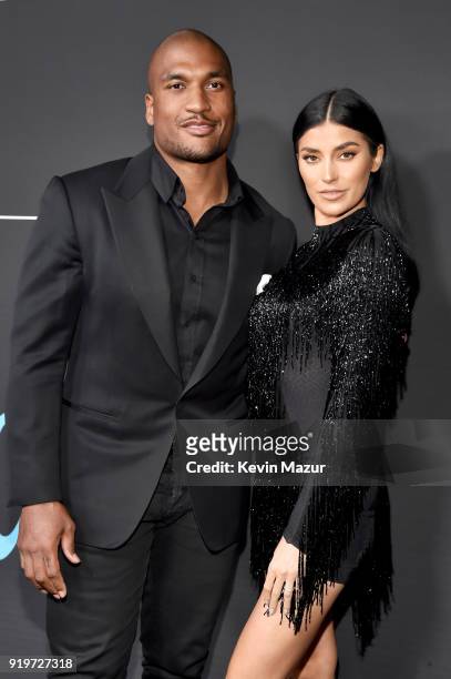 Larry English and Nicole Williams attend GQ's 2018 All-Stars Celebration at Nomad Hotel Los Angeles on February 17, 2018 in Los Angeles, California.