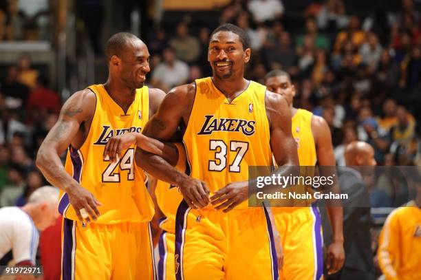 Kobe Bryant and Ron Artest of the Los Angeles Lakers share a laugh during their game against the Charlotte Bobcats at Staples Center on October 17,...