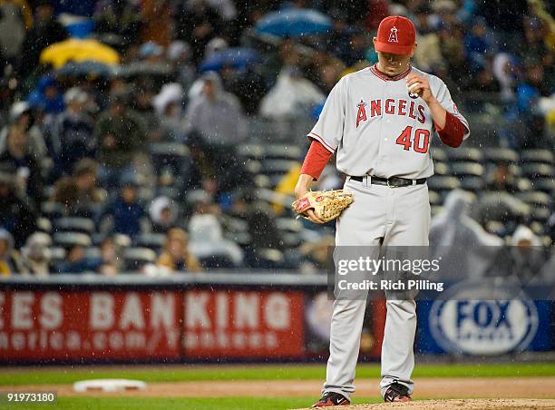 Brian Fuentes of the Los Angeles Angels of Anaheim stands on the mound in the rain in the eleventh inning of Game Two of the ALCS against the New...