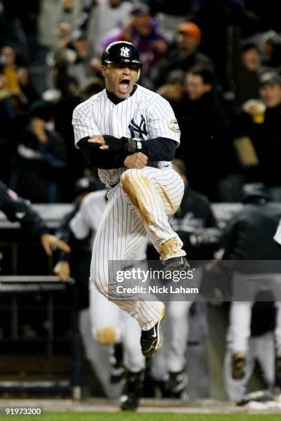 Jerry Hairston Jr. Of the New York Yankees celebrates scoring on a throwing error by Maicer Izturis of the Los Angeles Angels of Anaheim to win Game...