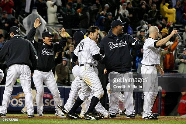 The New York Yankees celebrate their 4-3 victory over the Los Angeles Angels of Anaheim in Game Two of the ALCS during the 2009 MLB Playoffs at...