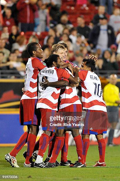 Dallas team members celebrate a goal scored by defender Ugo Ihemelu of FC Dallas at Pizza Hut Park on October 17, 2009 in Frisco, Texas.
